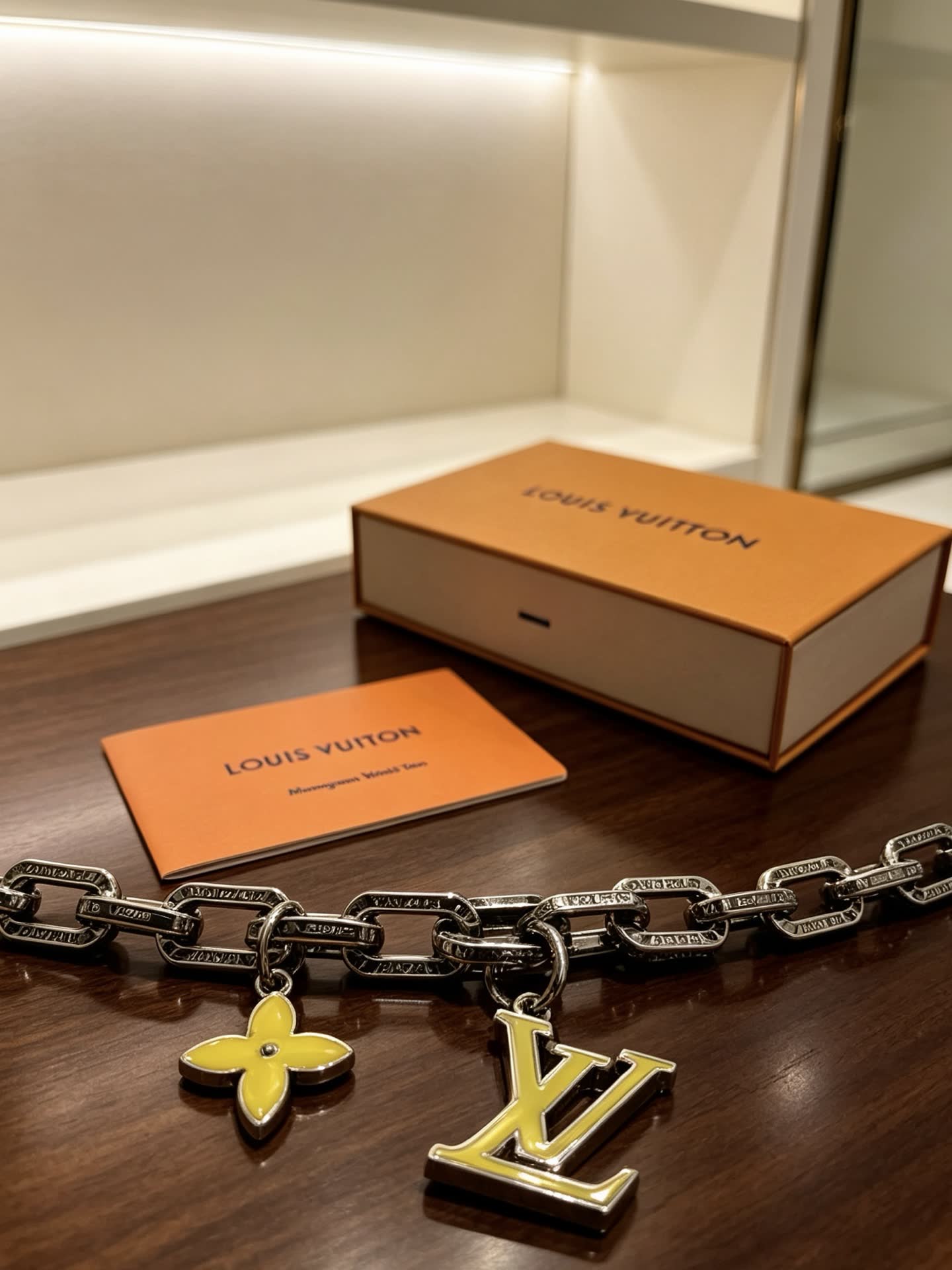 Louis Vuitton Silver Bracelet with LV Logo and Flower Charm